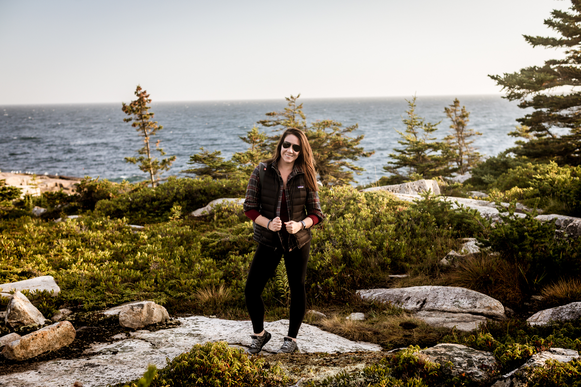 acadia | Fall Sunglasses Trends: the New Ray-Ban for Women Now Available at Kohl's by popular New England fashion blogger Shannon Shipman: image of a woman standing outside by the ocean and wearing Kohl's Ray-Ban RB3025 Original Aviator 58mm Sunglasses.