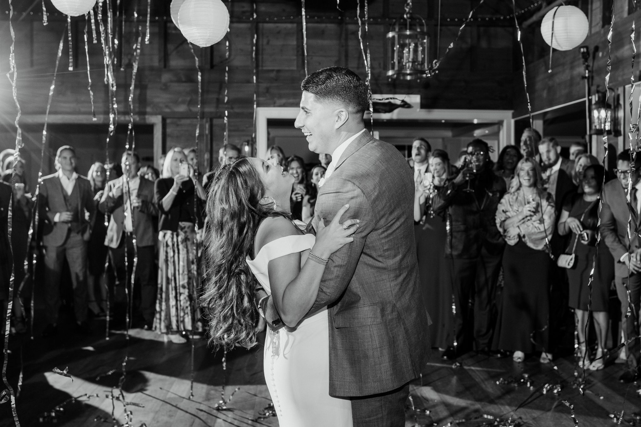 Wedding Photography Tips: How to Take Gorgeous Indoor Wedding Photos by popular New England photographer, Shannon Shipman: image of a bride and groom dancing together. 