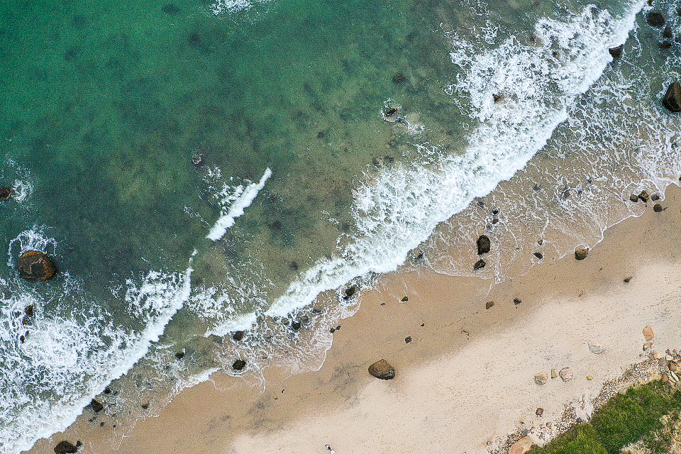 Instagram Bio Tips by popular New England influencer, Shannon Shipman: aerial image of a beach.