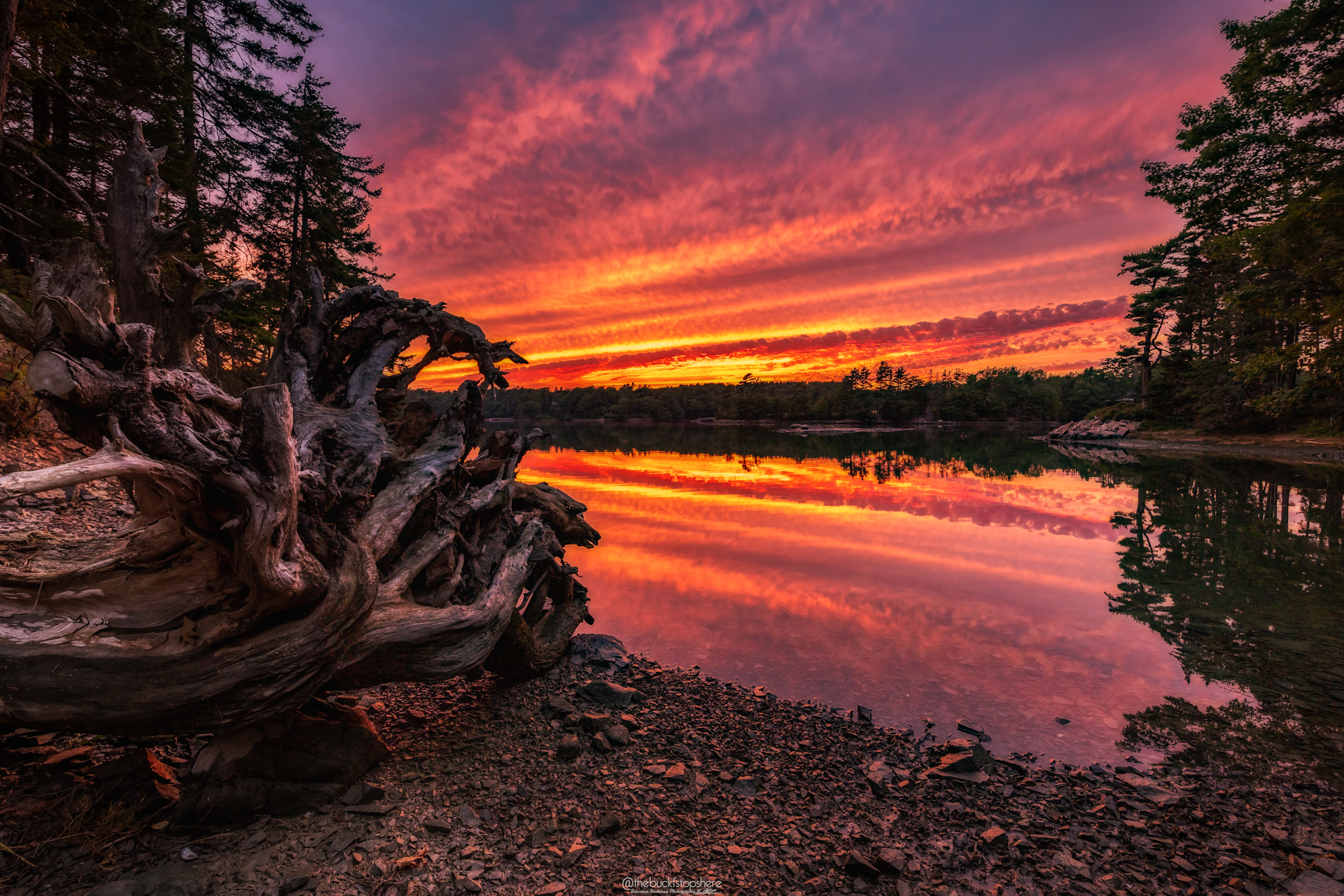 How to start a photography business by popular New England photographer, Shannon Shipman: image of a mountain lake with a purple, red, pink and orange sunset in the background. 