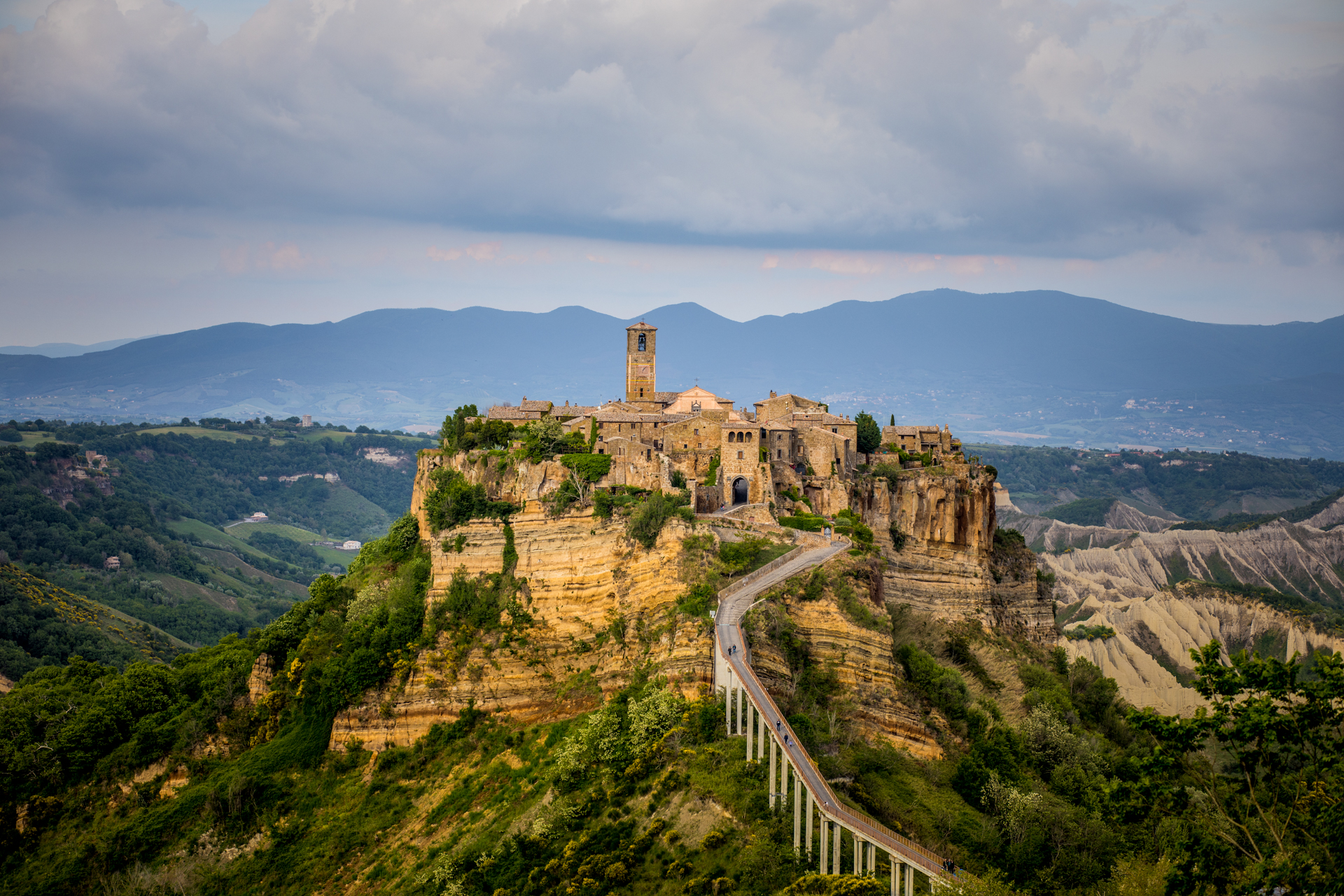 10 Gorgeous Views in Tuscany Italy | Tuscany Photos by popular New England travel blogger, Shannon Shipman: image of a Tuscany, Italy village on a mountaintop. 