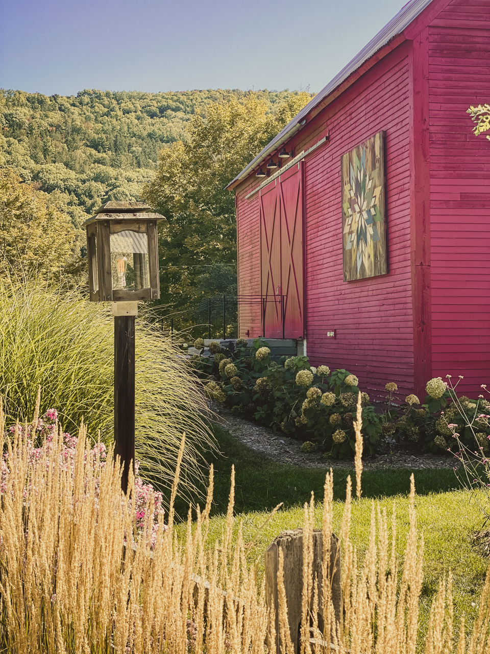 kelly way gardens | Woodstock Inn by popular New England travel blogger, Shannon Shipman: image of a red barn with a barn quilt on it's exterior.